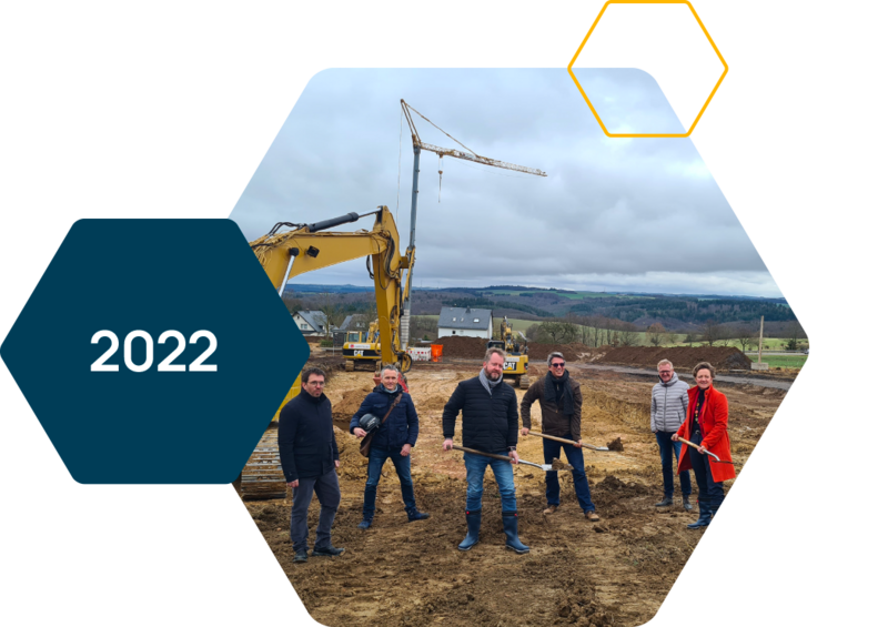 People on a construction site with a shovel in hand.